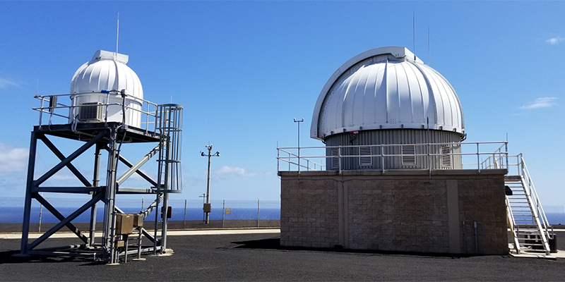 The ES-MCAT (right) and James R Benbrook telescope (left) both make up the John Africano NASA/AFRL Observatory on Ascension Island. Credit: NASA ODPO.